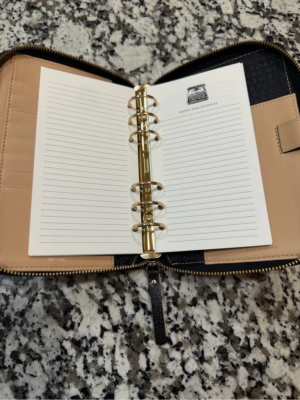 kate spade Black Pebbled Leather Zip Wallet with Gold Logo